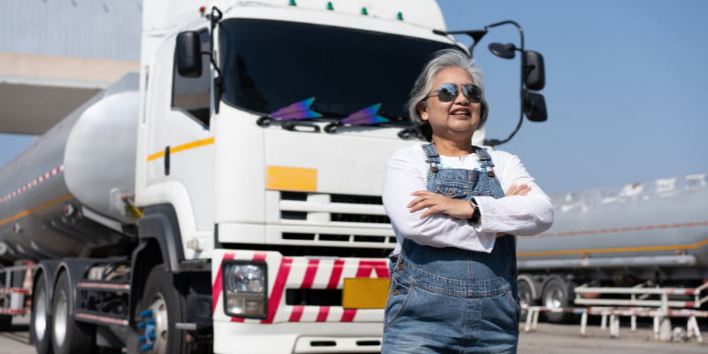 Women standing in front of truck, representing transportation employees